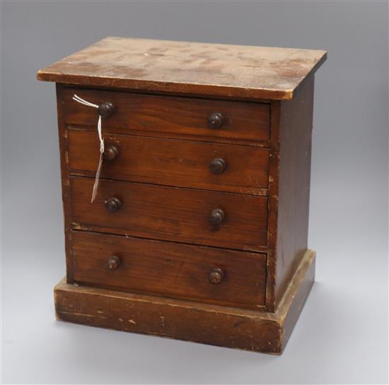 A late Victorian pine miniature chest of drawers height 33cm